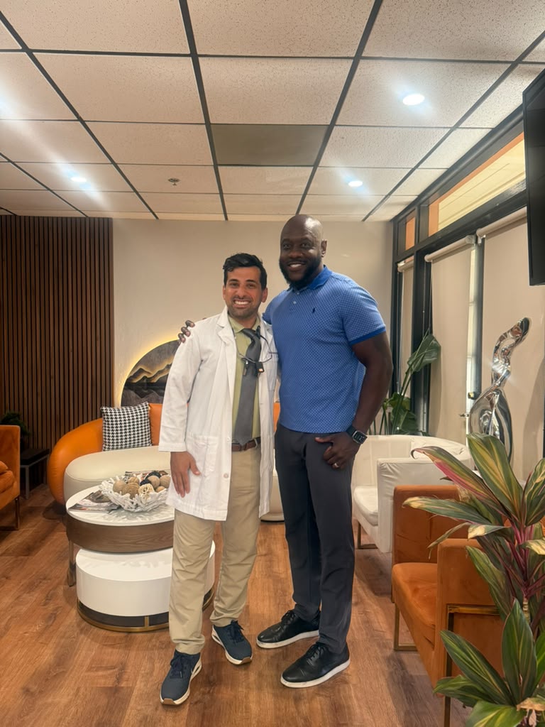 Dr. B celebrating with a patient