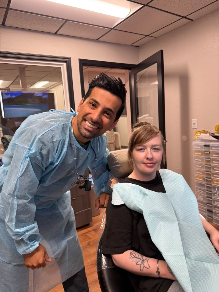 Dr. B with a patient after treatment